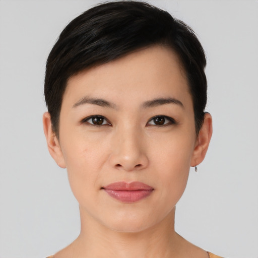Joyful asian young-adult female with short  black hair and brown eyes