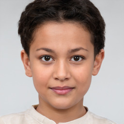 Joyful white child female with short  brown hair and brown eyes