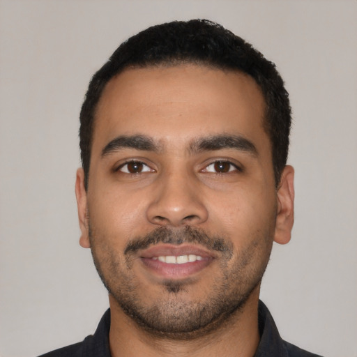 Neutral latino young-adult male with short  black hair and brown eyes