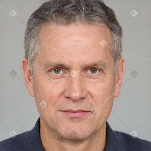 Neutral white middle-aged male with short  gray hair and brown eyes