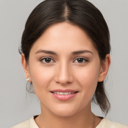 Joyful white young-adult female with medium  brown hair and brown eyes