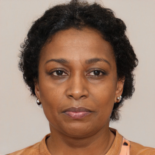 Neutral black adult female with medium  brown hair and brown eyes