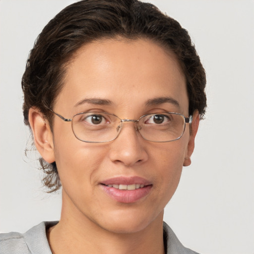 Joyful white adult female with short  brown hair and brown eyes