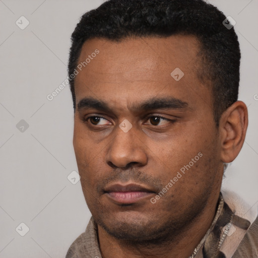 Neutral latino young-adult male with short  black hair and brown eyes