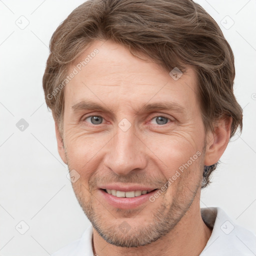 Joyful white adult male with short  brown hair and grey eyes