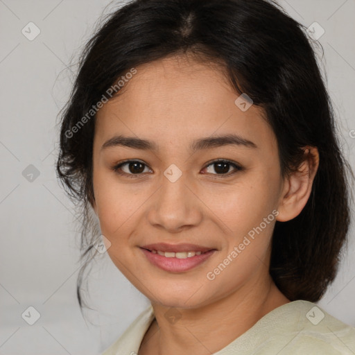 Joyful latino young-adult female with medium  brown hair and brown eyes