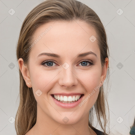 Joyful white young-adult female with medium  brown hair and grey eyes