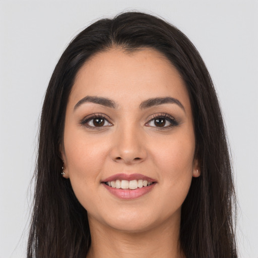 Joyful white young-adult female with long  brown hair and brown eyes