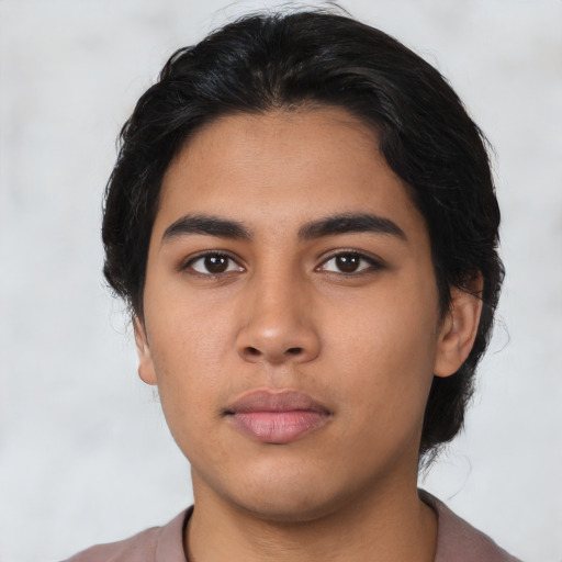 Neutral latino young-adult male with short  black hair and brown eyes