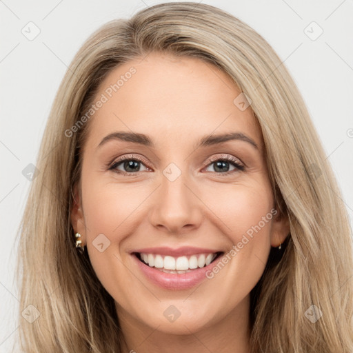 Joyful white young-adult female with long  brown hair and brown eyes