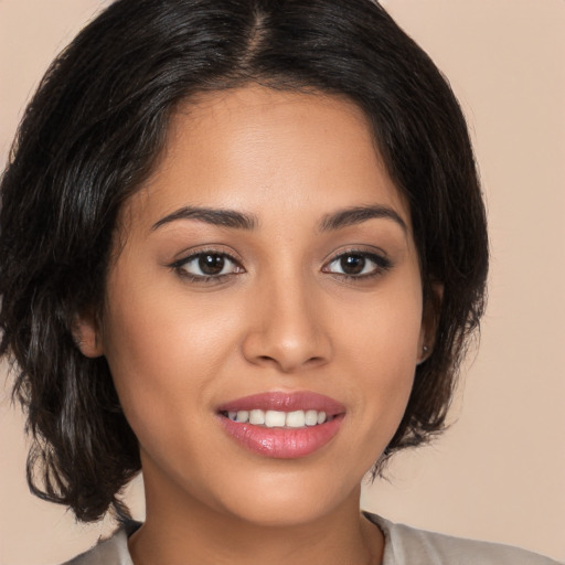 Joyful white young-adult female with medium  brown hair and brown eyes