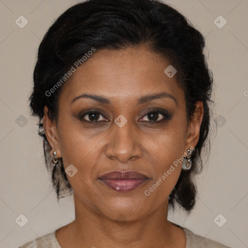 Joyful black adult female with medium  brown hair and brown eyes
