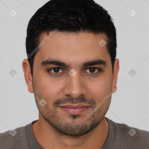 Joyful latino young-adult male with short  black hair and brown eyes