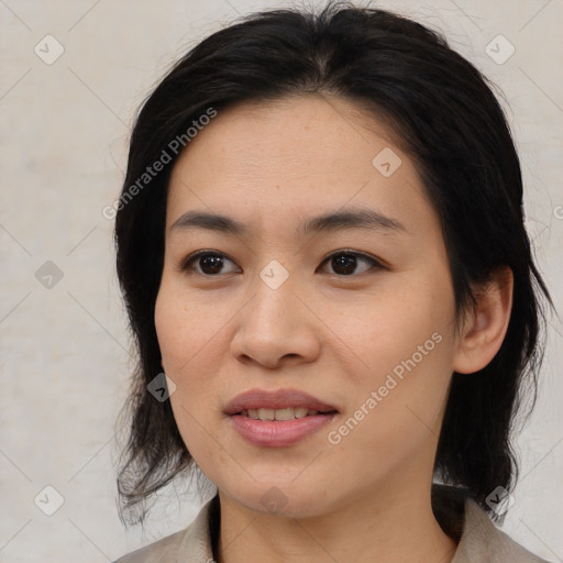 Joyful asian young-adult female with medium  black hair and brown eyes