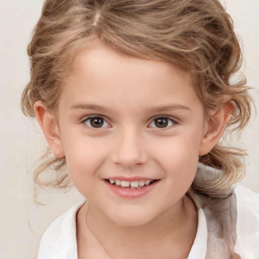 Joyful white child female with medium  brown hair and brown eyes