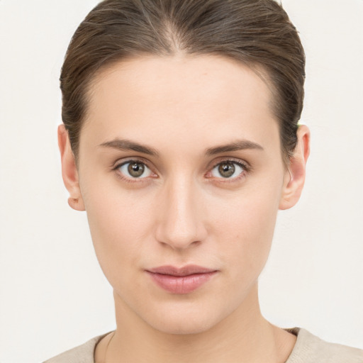 Neutral white young-adult female with short  brown hair and brown eyes