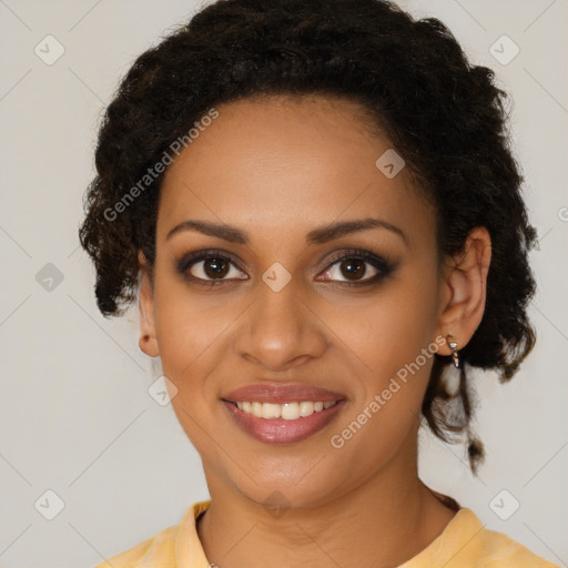 Joyful black young-adult female with medium  brown hair and brown eyes