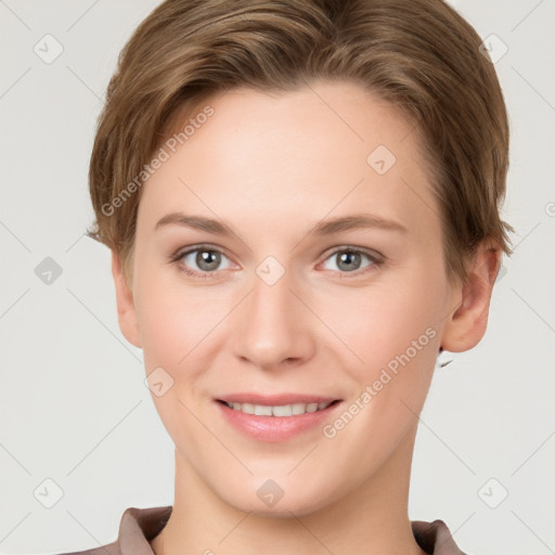 Joyful white young-adult female with short  brown hair and grey eyes