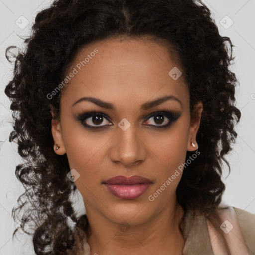 Joyful black young-adult female with long  brown hair and brown eyes