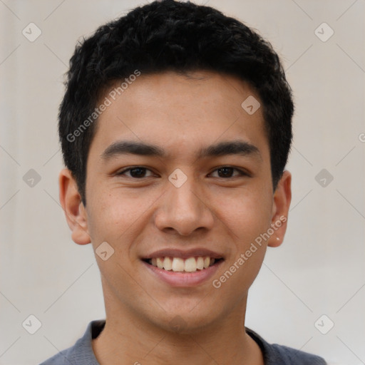 Joyful latino young-adult male with short  black hair and brown eyes