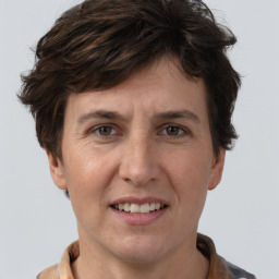 Joyful white adult female with short  brown hair and brown eyes