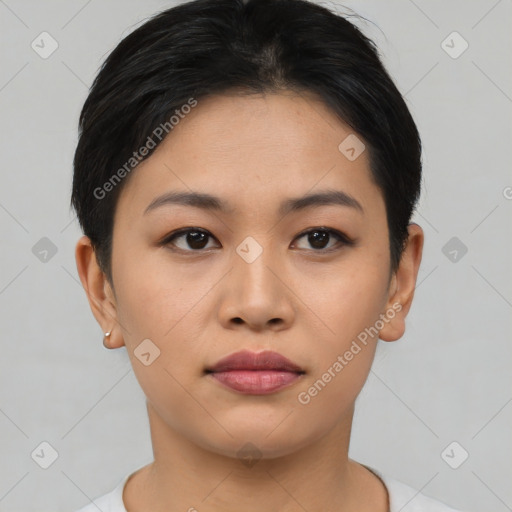 Joyful asian young-adult female with short  black hair and brown eyes