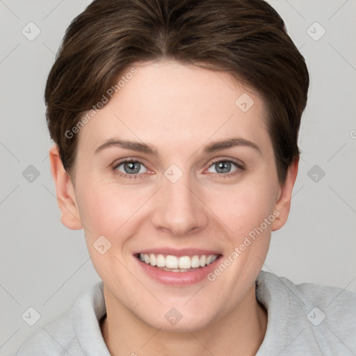 Joyful white young-adult female with short  brown hair and grey eyes