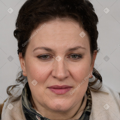 Joyful white adult female with medium  brown hair and blue eyes