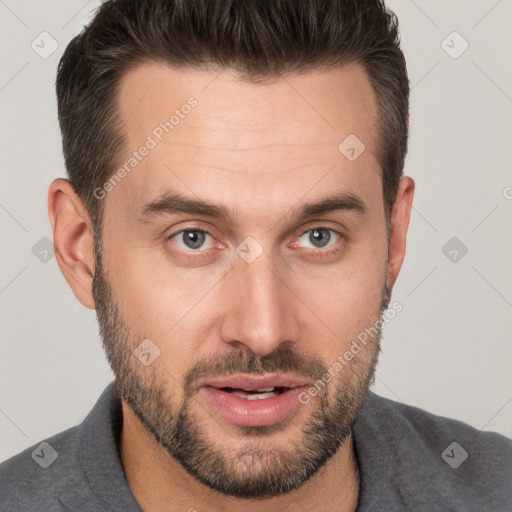 Joyful white adult male with short  brown hair and brown eyes