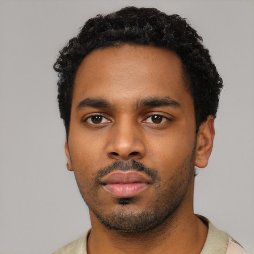 Neutral black young-adult male with short  black hair and brown eyes