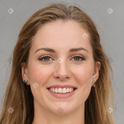 Joyful white young-adult female with long  brown hair and green eyes