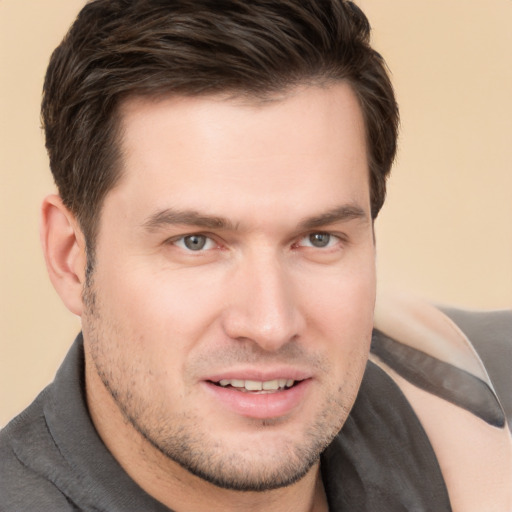 Joyful white young-adult male with short  brown hair and brown eyes