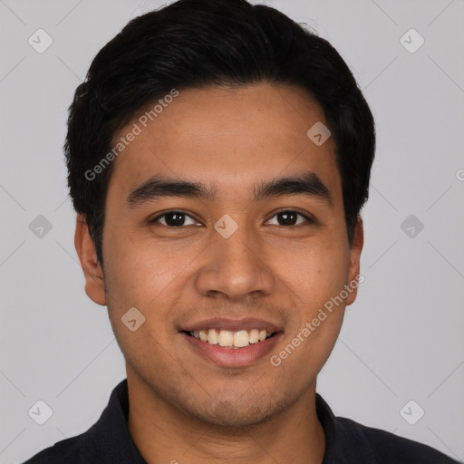 Joyful latino young-adult male with short  black hair and brown eyes