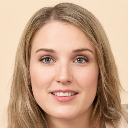 Joyful white young-adult female with long  brown hair and green eyes