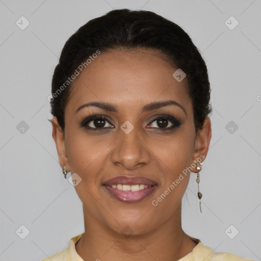 Joyful black young-adult female with short  brown hair and brown eyes