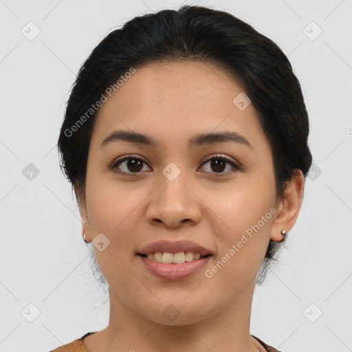 Joyful latino young-adult female with medium  brown hair and brown eyes