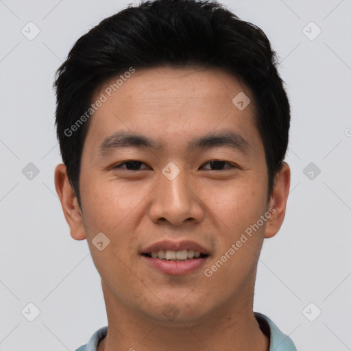 Joyful asian young-adult male with short  black hair and brown eyes