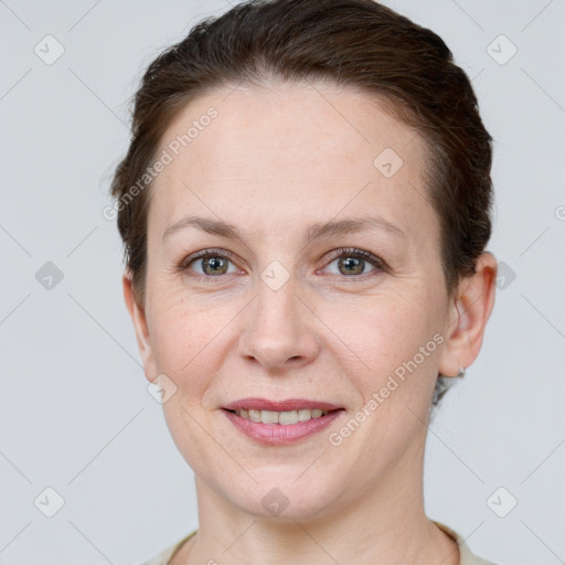 Joyful white adult female with short  brown hair and grey eyes