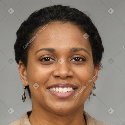 Joyful black young-adult female with short  brown hair and brown eyes