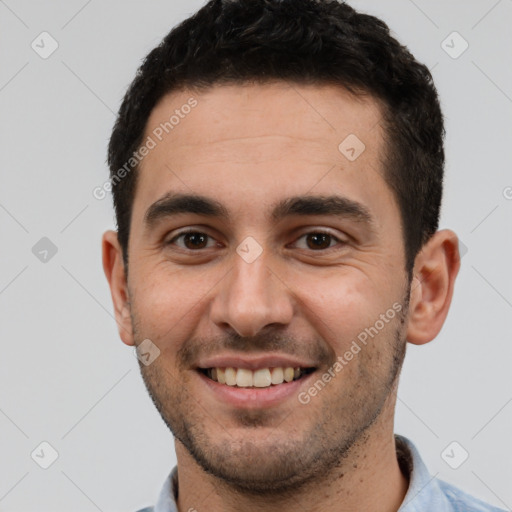 Joyful white young-adult male with short  black hair and brown eyes