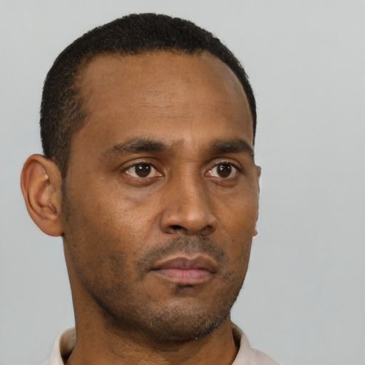 Neutral black young-adult male with short  black hair and brown eyes