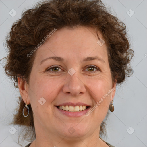 Joyful white adult female with medium  brown hair and green eyes