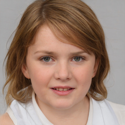 Joyful white child female with medium  brown hair and blue eyes