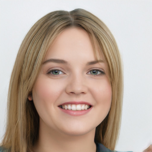 Joyful white young-adult female with long  brown hair and blue eyes