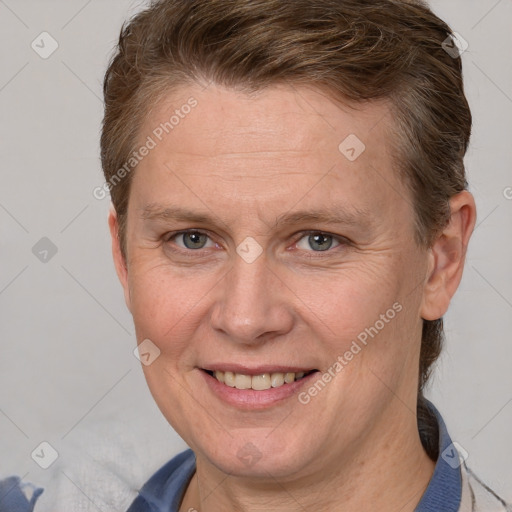 Joyful white adult female with short  brown hair and grey eyes