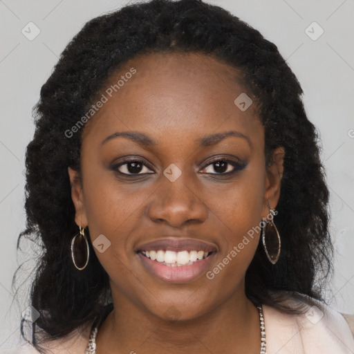 Joyful black young-adult female with long  brown hair and brown eyes