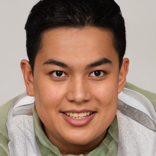 Joyful latino young-adult male with short  brown hair and brown eyes