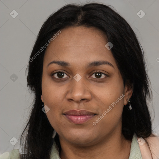 Joyful black young-adult female with long  black hair and brown eyes