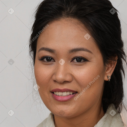 Joyful asian young-adult female with long  brown hair and brown eyes