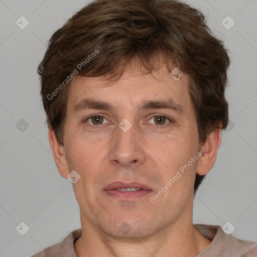 Joyful white adult male with short  brown hair and grey eyes